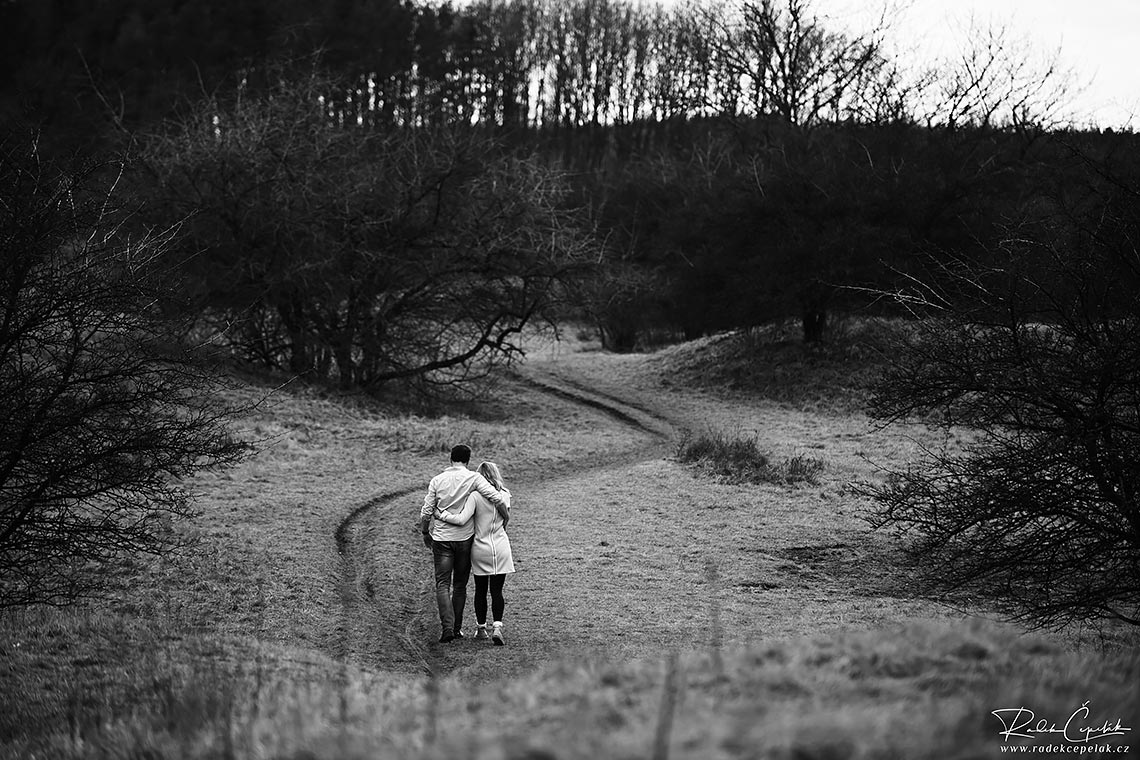 couple in love walking on the path in the nature