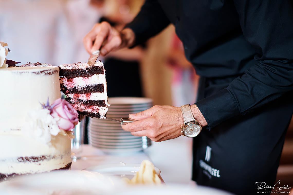 Wedding staff cutting chococlate cake