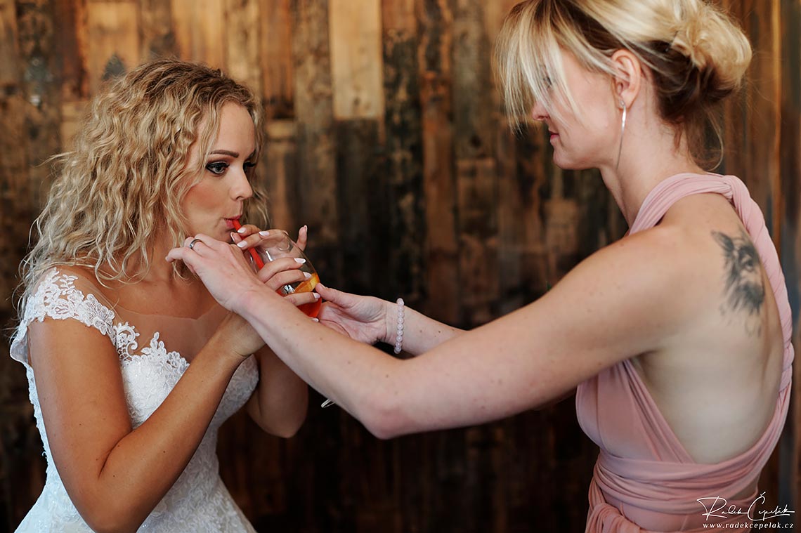 bride drinking alcohol before wedding ceremony