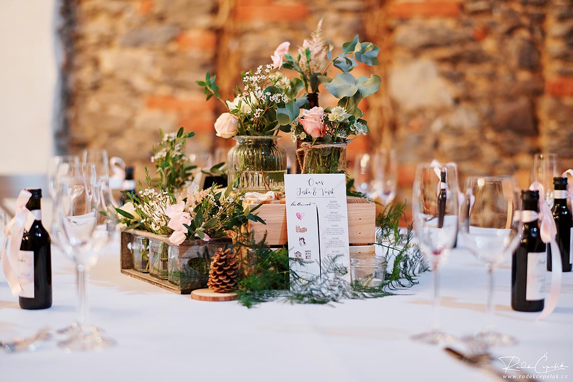 wedding floral decoration of tables in barn
