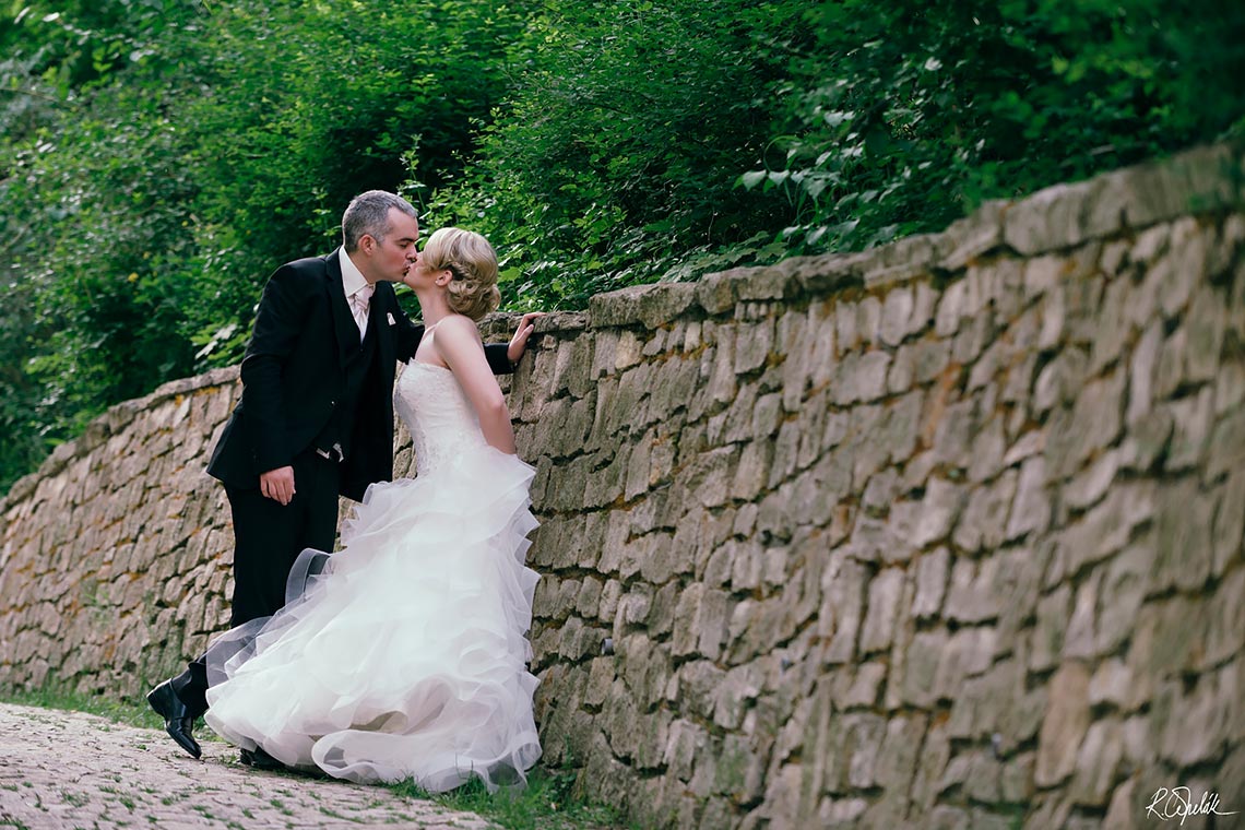 newlyweds couple photography by the old stone wall