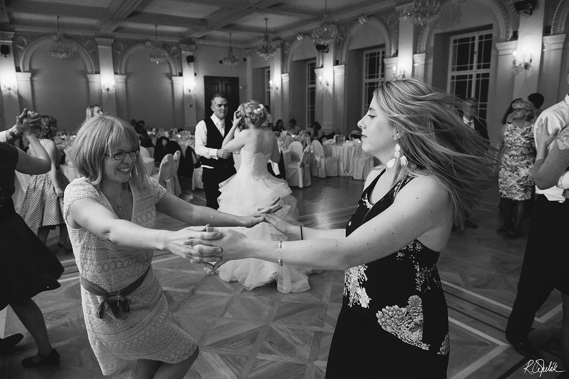 dancing guests at wedding party in Zofin palace in Prague