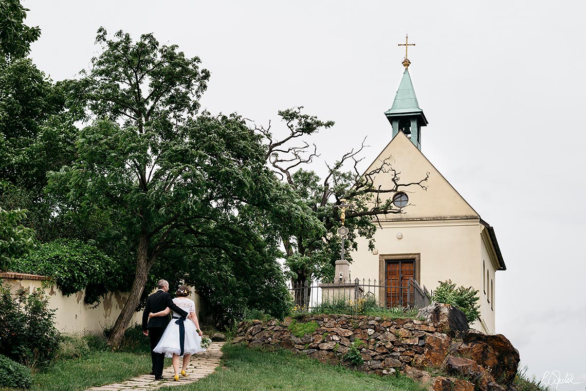 wedding photo with small church