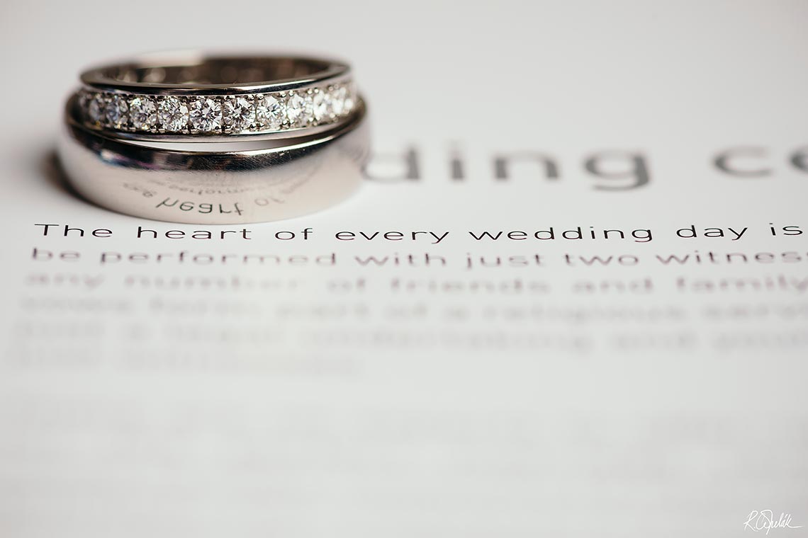 wedding rings on book detail macro photography