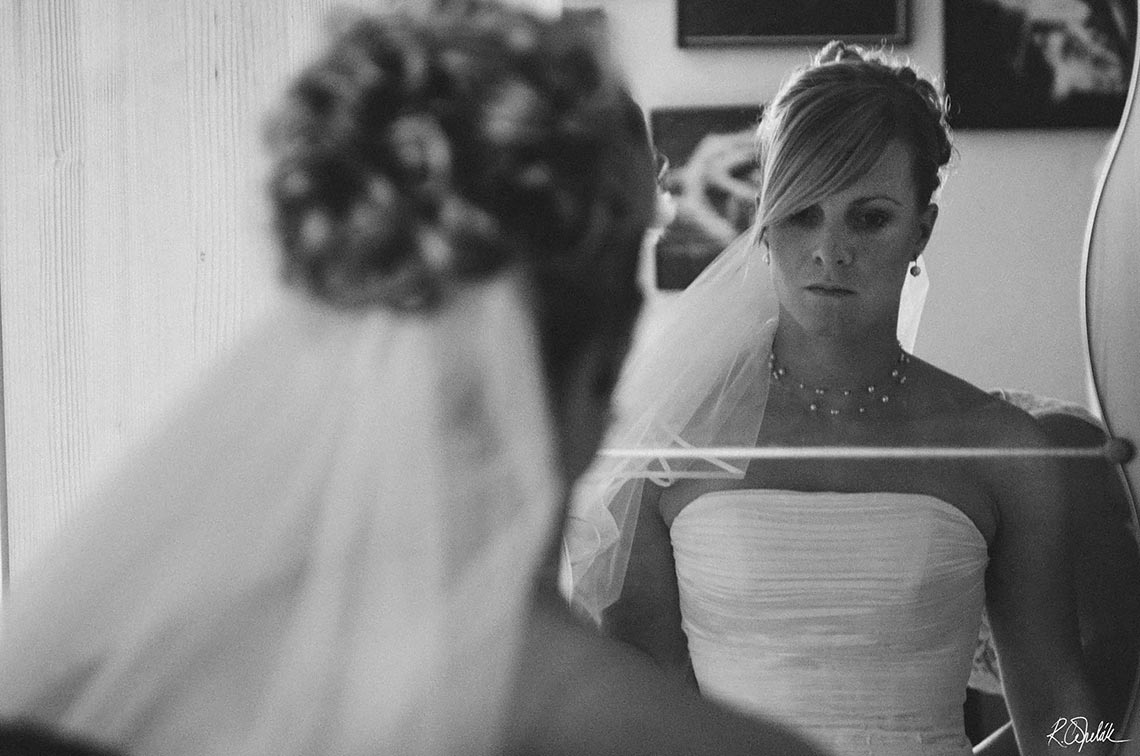 black and white photo of bride in the mirror