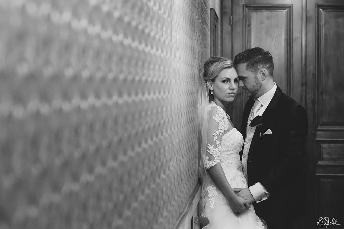 wedding photo of newlyweds in corridor at Chateu St. Havel in Prague