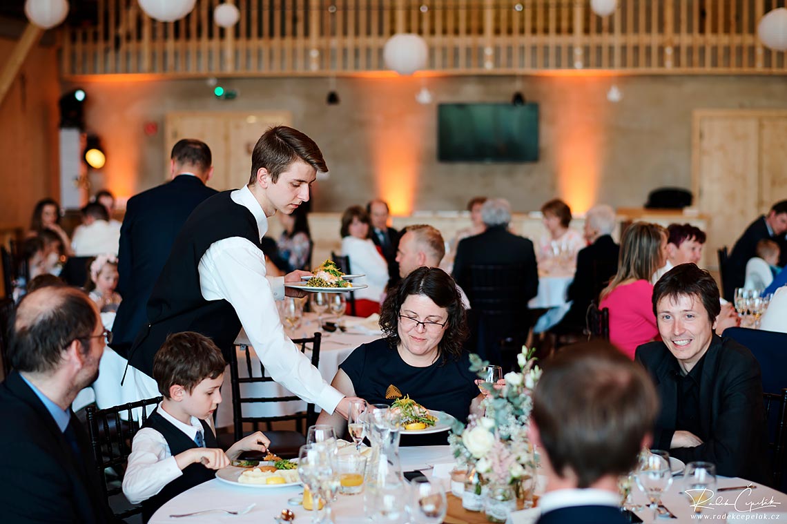 staff serving the food at wedding in barn Greta in Slovakia