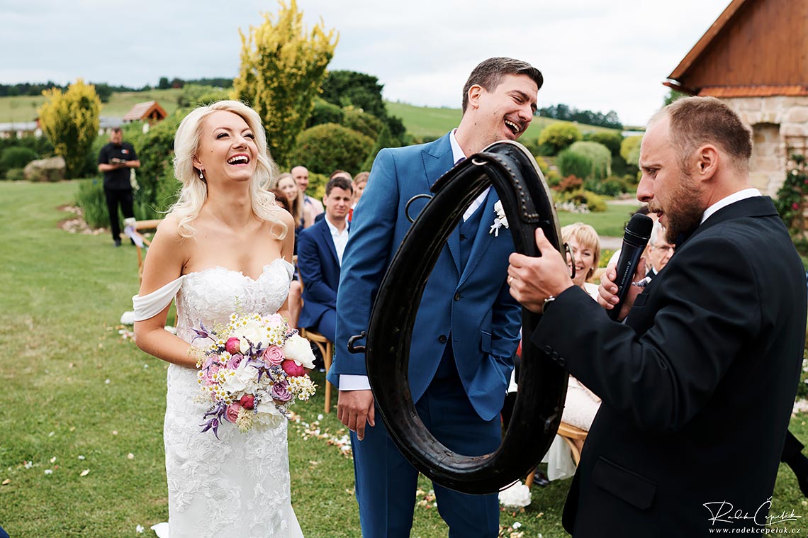 Priest makes bride and groom laughed after wedding ceremony in Hejtmankovice.