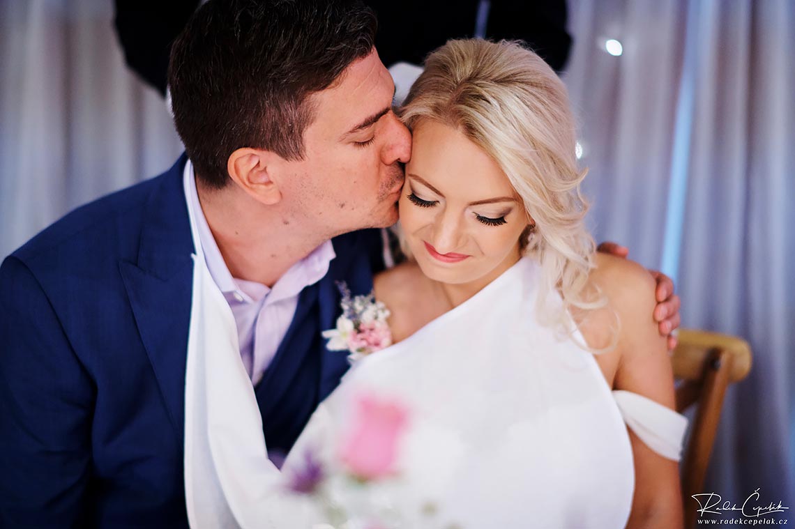 Sweet lovely kiss by groom to bride 