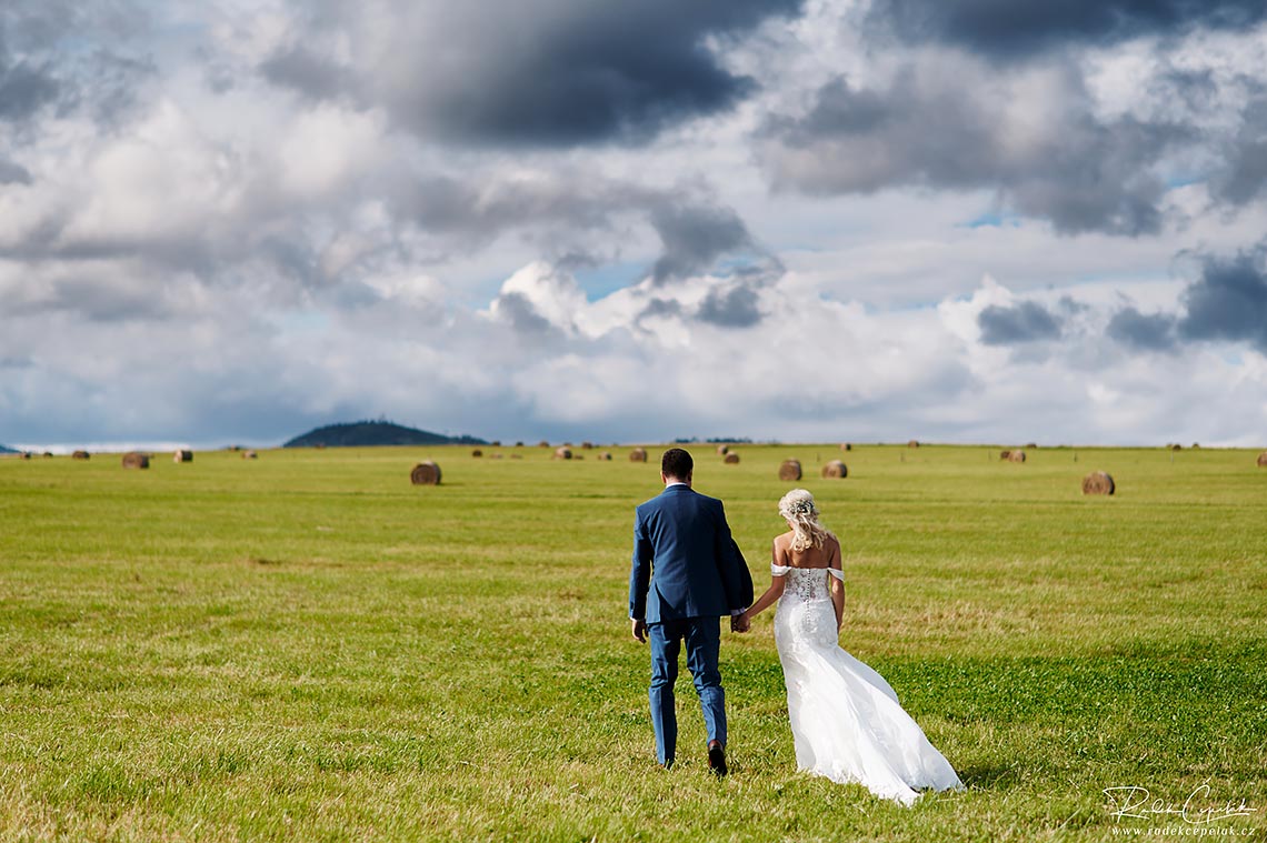 Wedding photography of bride and groom with interesting sky clouds
