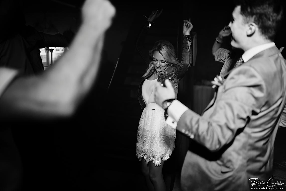 black and white photo of bride dancing on the dance floor