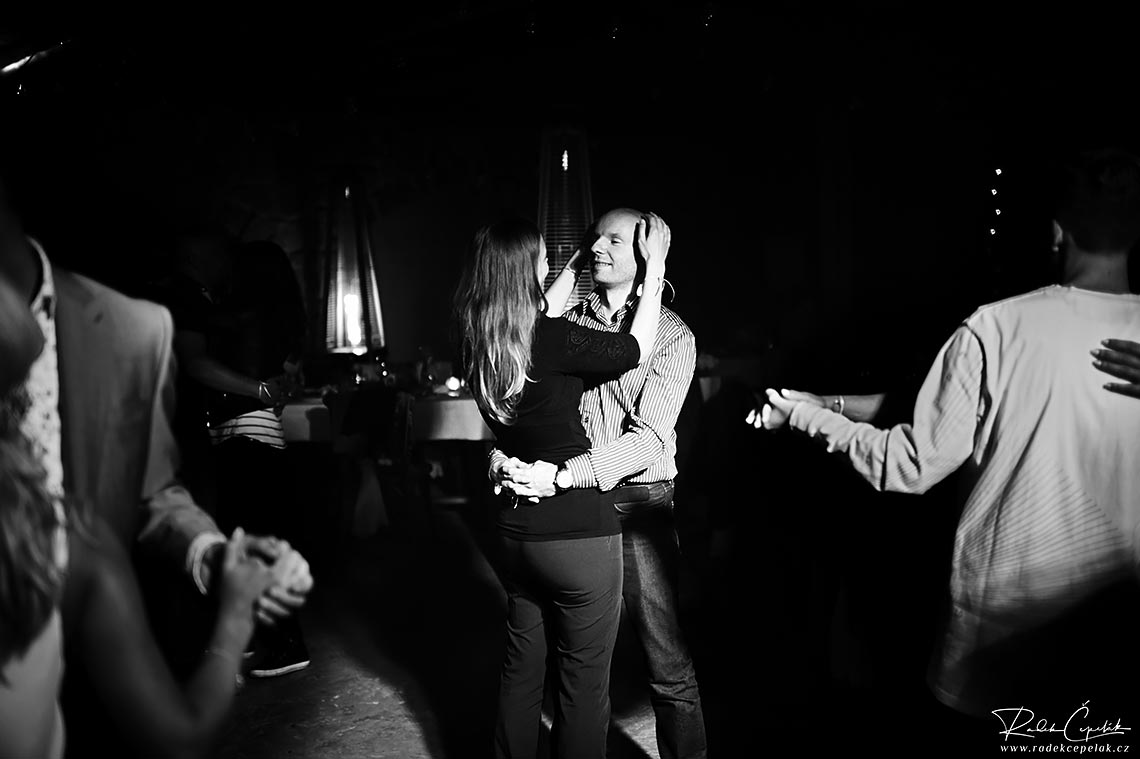 Black and white photo of wedding guests dancing on the floor