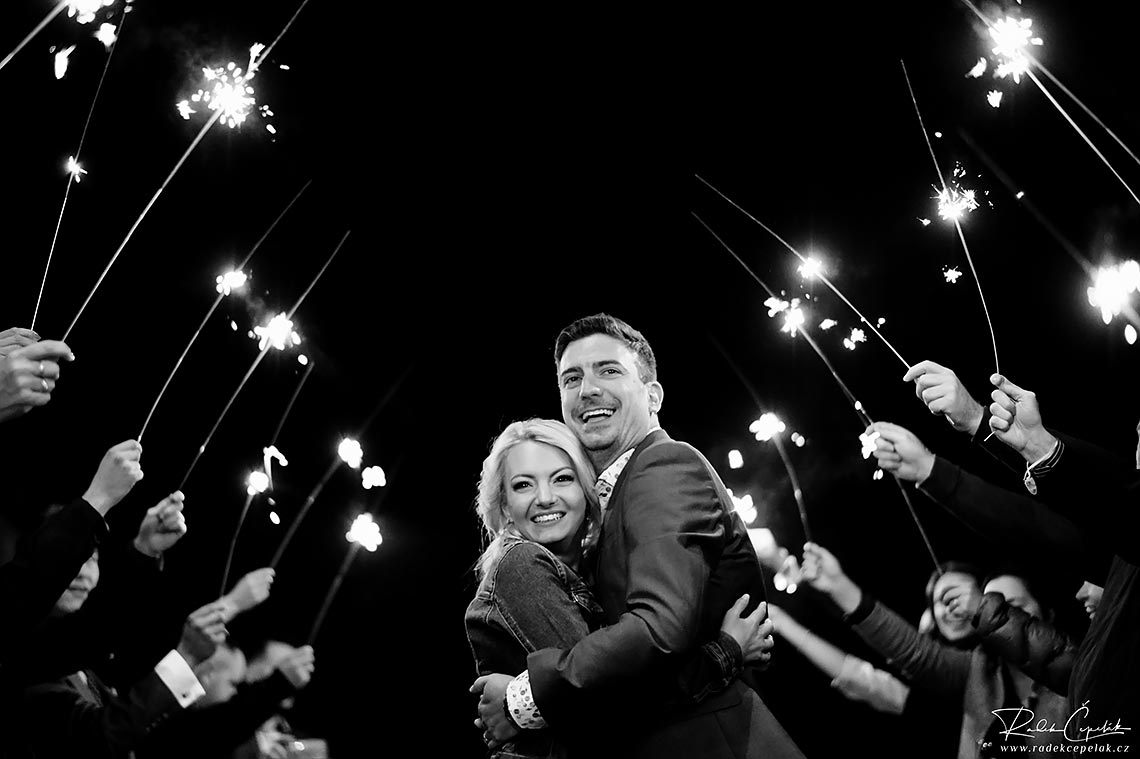 Black and white wedding photography of bride and groom with sparkles