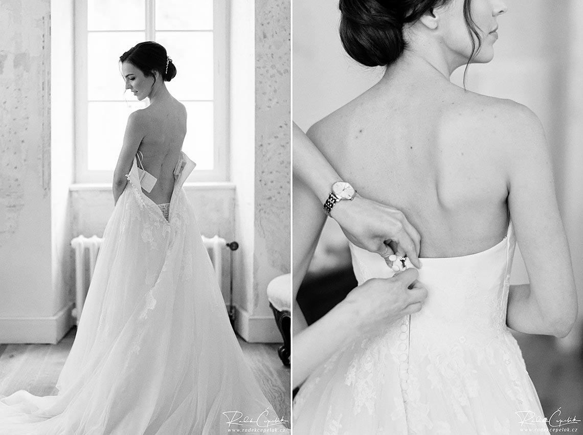 bride putting dress on black and white wedding photography