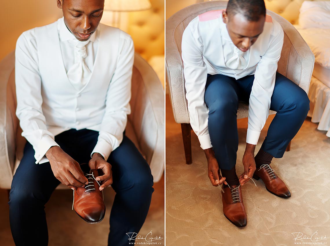groom putting a brown shoes on