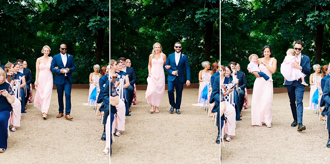groom and bridesmaids in pink dress at wedding