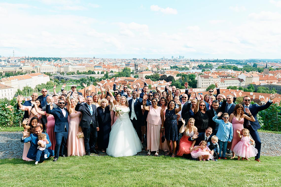 Group photo of bride and groom with guests