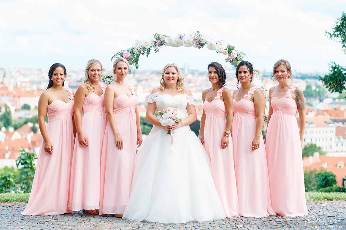 bride with her bridesmaids in pink dress