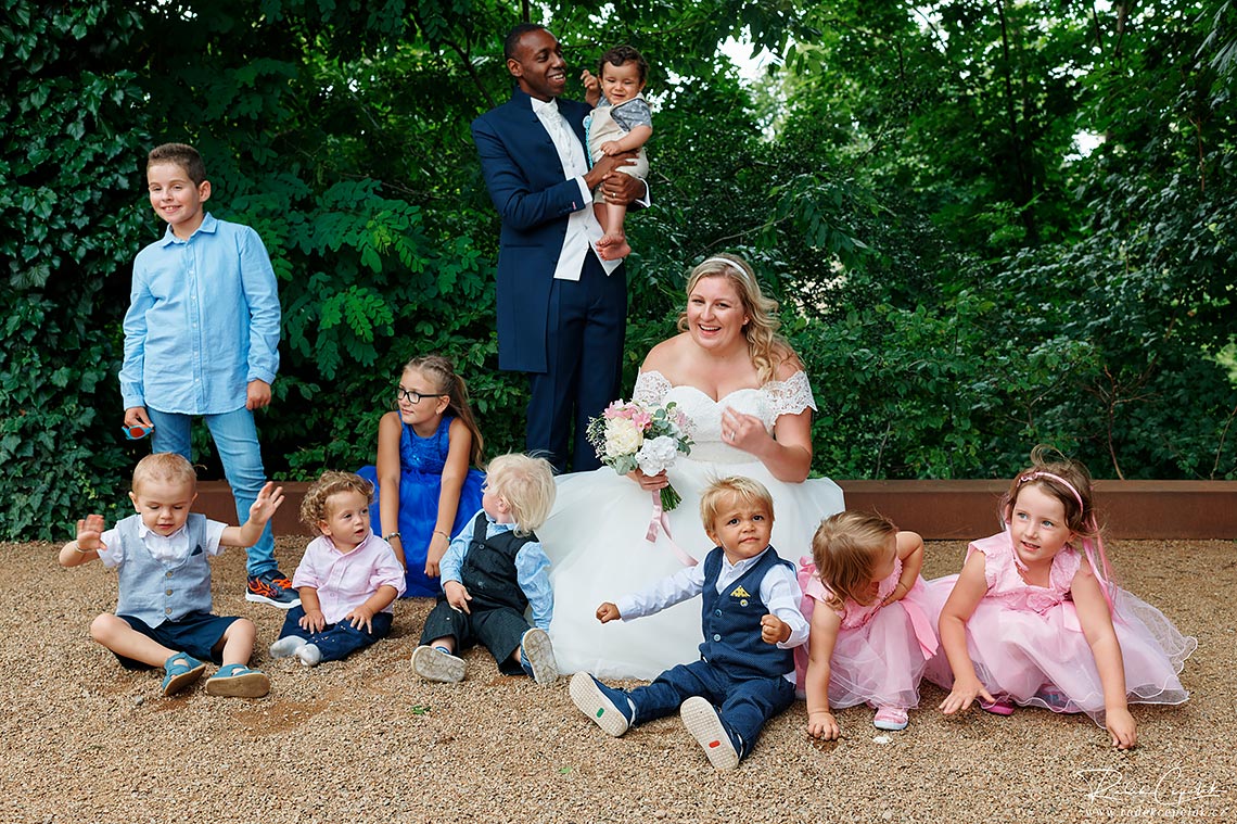 bride and groom with children