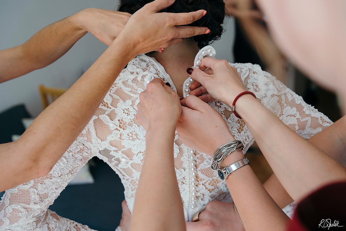 buttoning a wedding dress - fastening a buttons