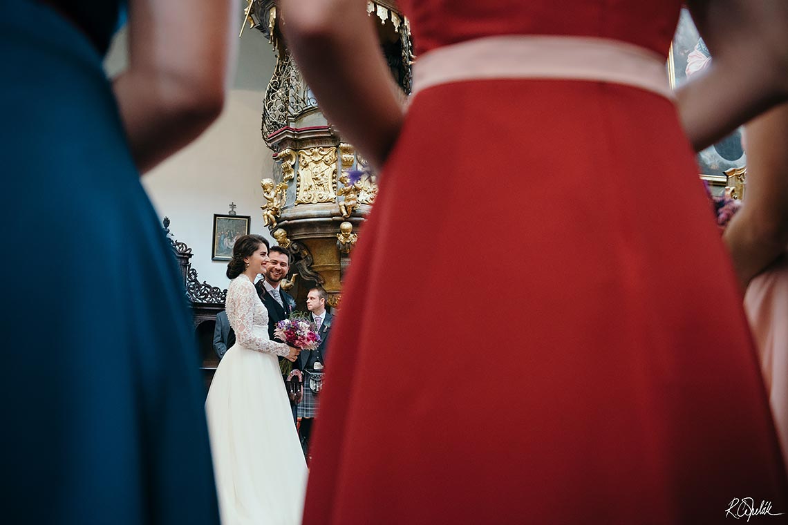 wedding ceremony in church St. Thomas in Prague