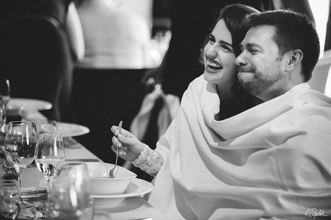 bride with groom eating their newlyweds soup with one spoon