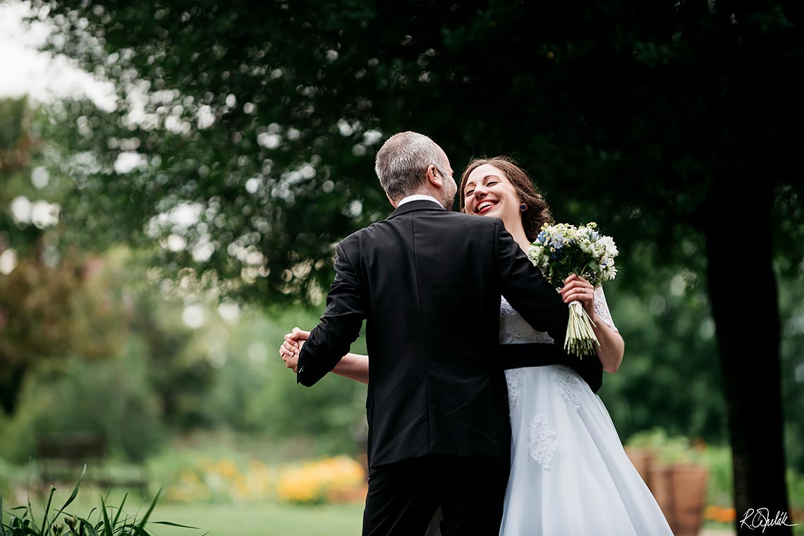 smiling bride with groom