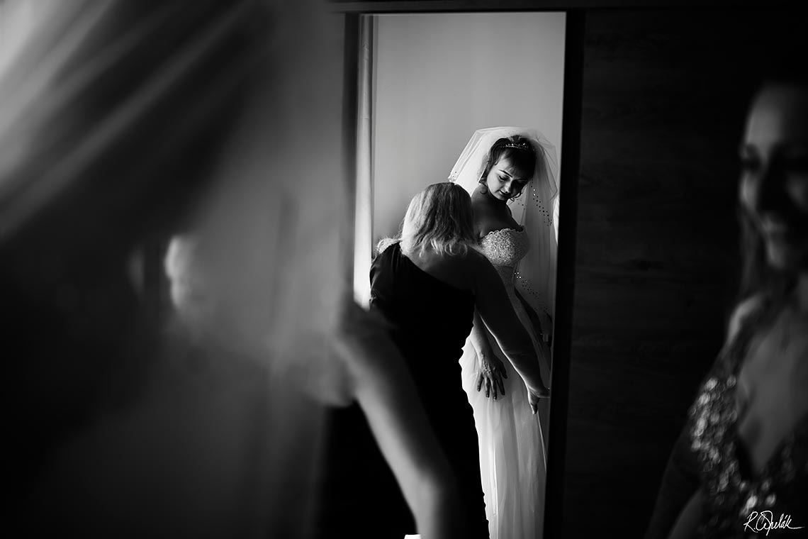 black and white wedding photography of bride getting ready