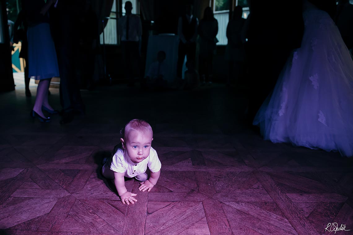 funny snapshot of baby on the dance floor at wedding