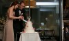 cutting the cake at wedding at the midnight