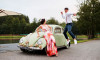wedding photography of bride and groom with vw beatle car
