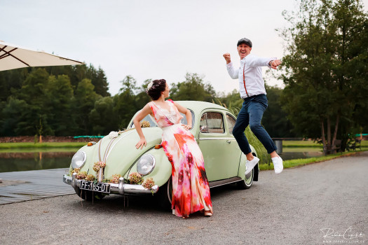 wedding photography of bride and groom with vw beatle car