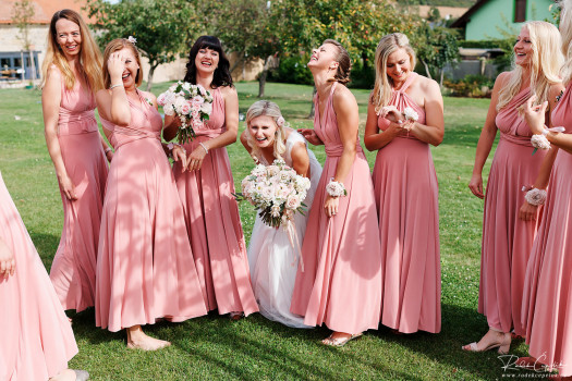 wedding photography of bride with bridesmaids smiling moment