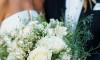 bride and groom with bouquet wedding photo