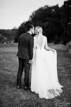 bride and groom kissing during photoshoot