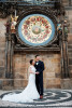 Wedding photo in front of Astronomical clock in Prague