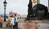 Morning wedding photo session in Prague with view at castle from Charles bridge